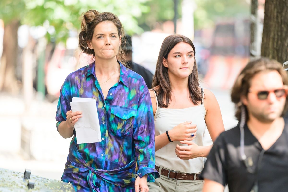 Katie Holmes and Suri Cruise are spotted walking together on the "Happy Hours" set in New York.