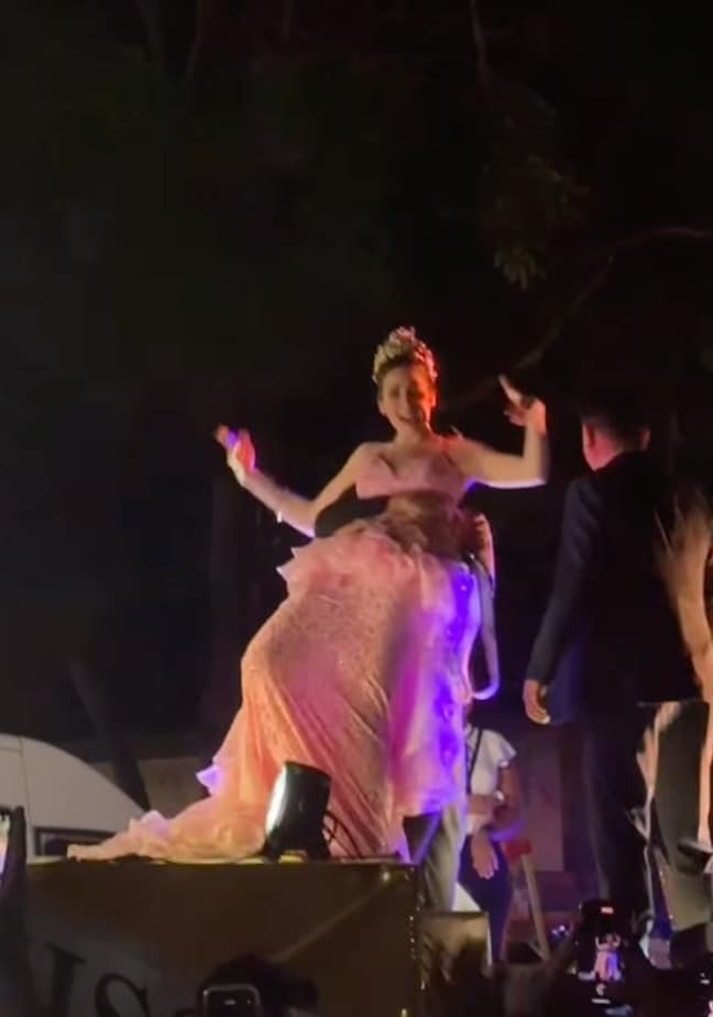 She kept dancing as one of her team members lifted her up to escort her off the stage.