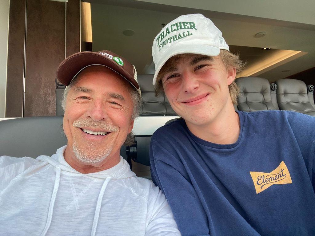 photo of don johnson and son deacon in baseball hats