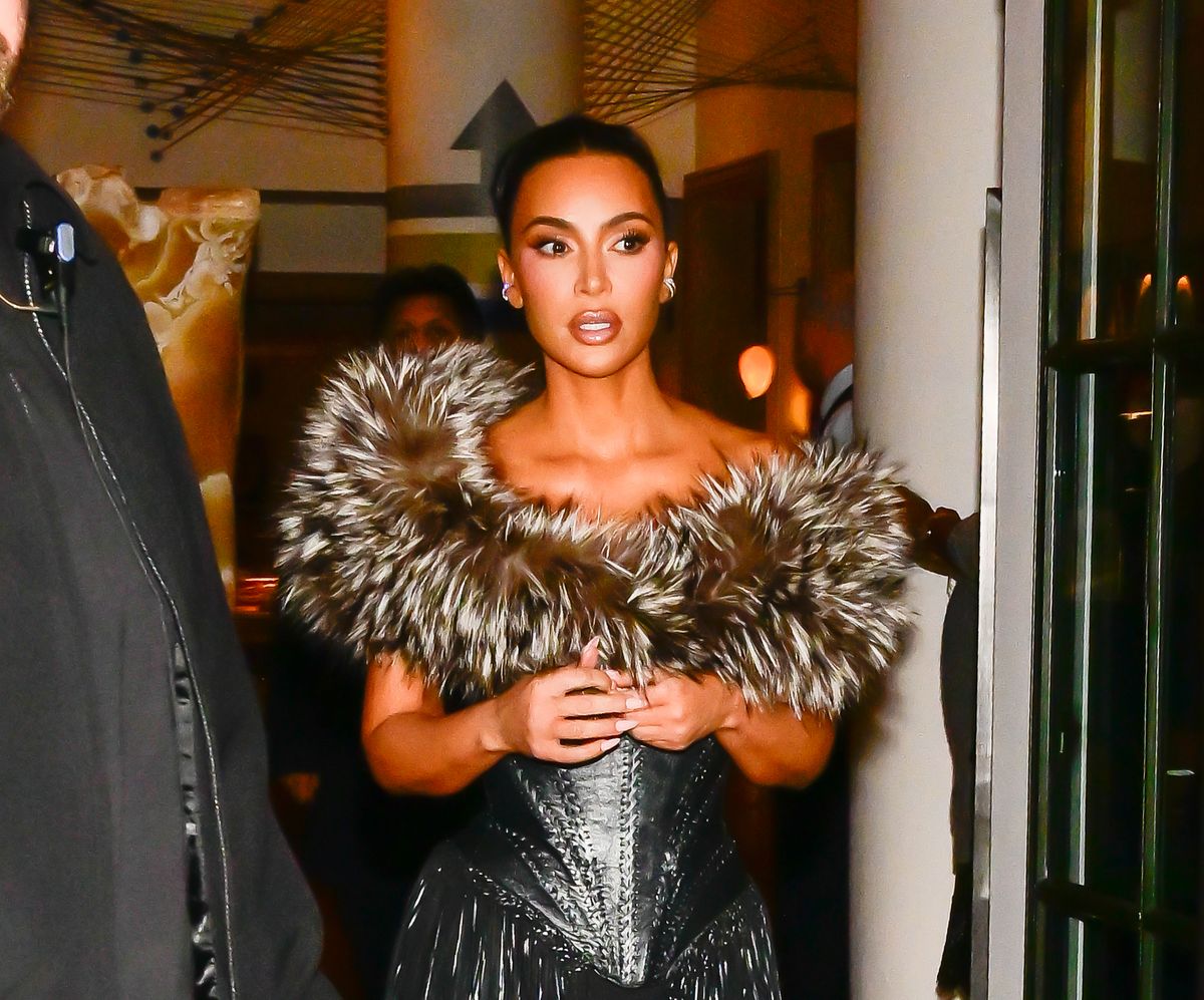 Kim Kardashian heats up ‘Kimsmas’ in a curve-hugging, cleavage-baring dress