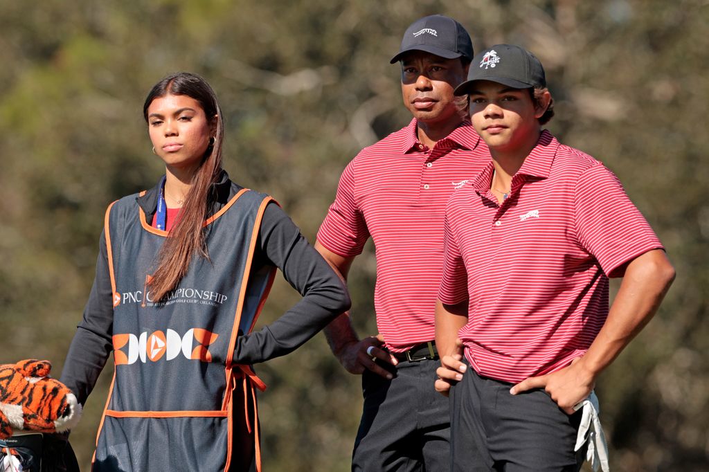 Tiger Woods of the United States with his son Charlie Woods and daughter Sam Woods prepare to tee off from the second tee during the second round of the PNC Championship at Ritz-Carlton Golf Club on December 22, 2024 in Orlando, Florida.