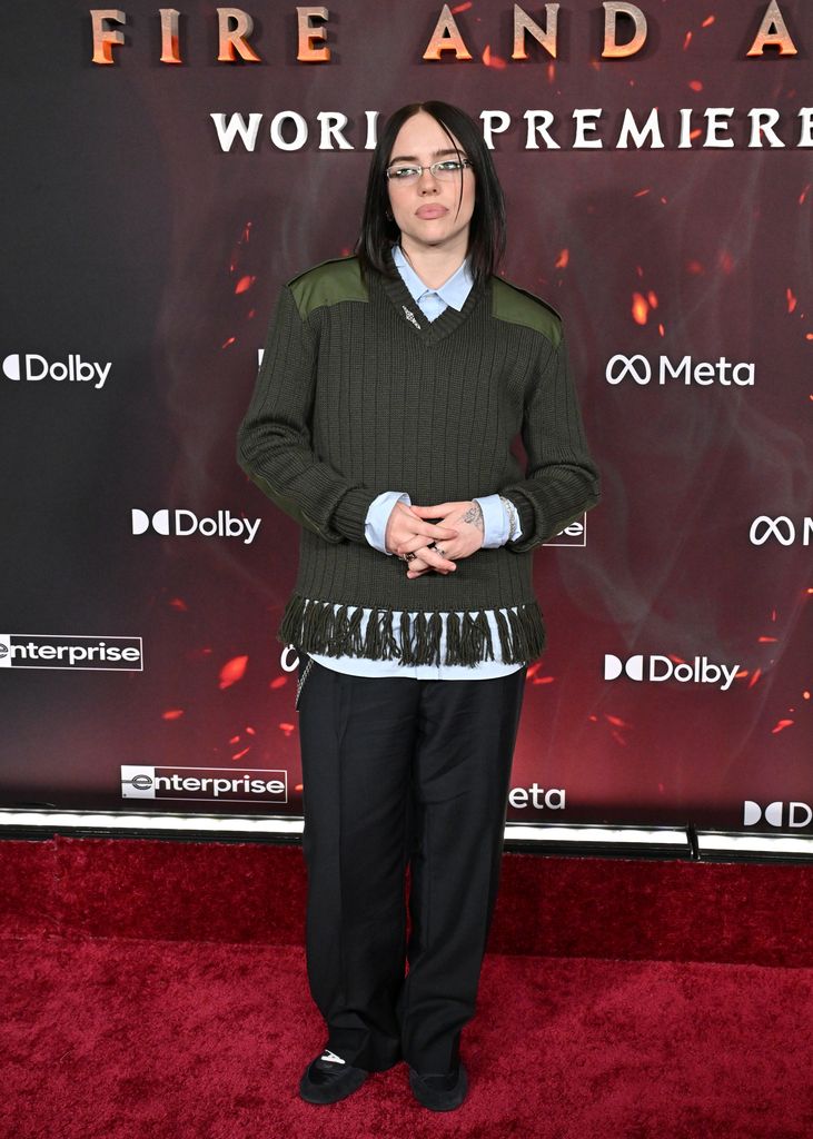 Billie Eilish in green jumper at the Global Premiere of 20th Century Studios' "Avatar: Fire and Ash" at Dolby Theatre 