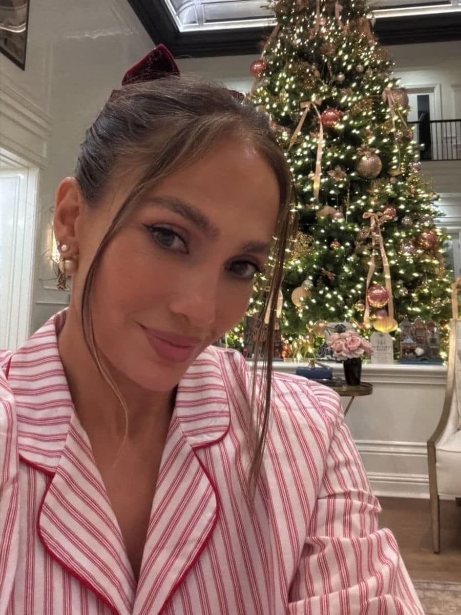 Jennifer Lopez ditched sequins for pink pajamas on Christmas eve, and the look was stylish and comfy