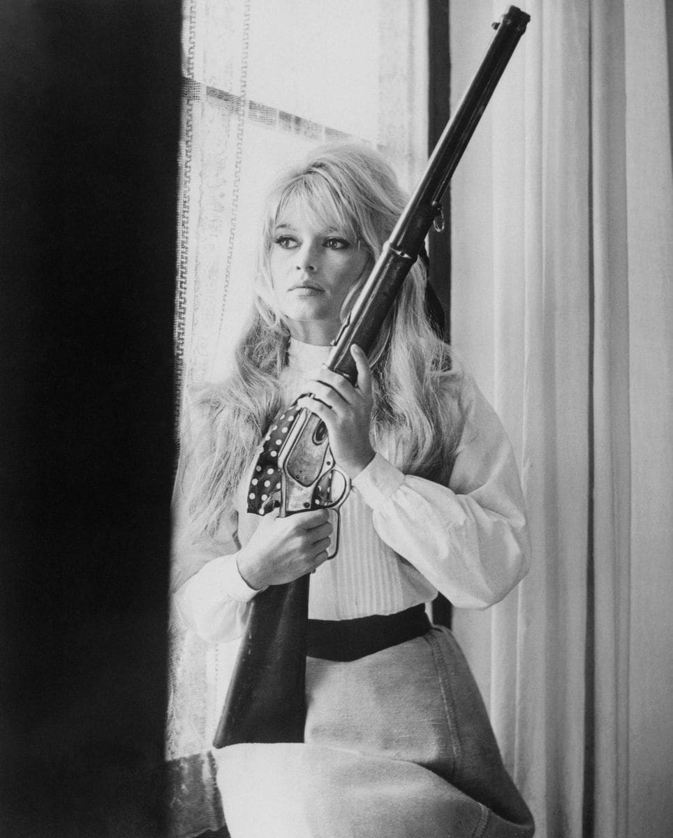 French actress Brigitte Bardot bears a lethal gun during a scene in her film, 'Viva Maria.' 