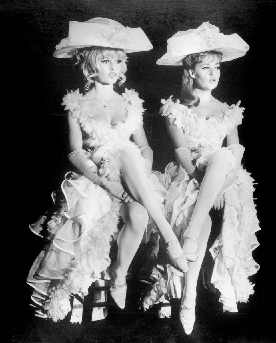 Brigitte Bardot, left, and Jeanne Moreau sing a risque French song as music hall performers in Louis Malle's 'Viva Maria.'