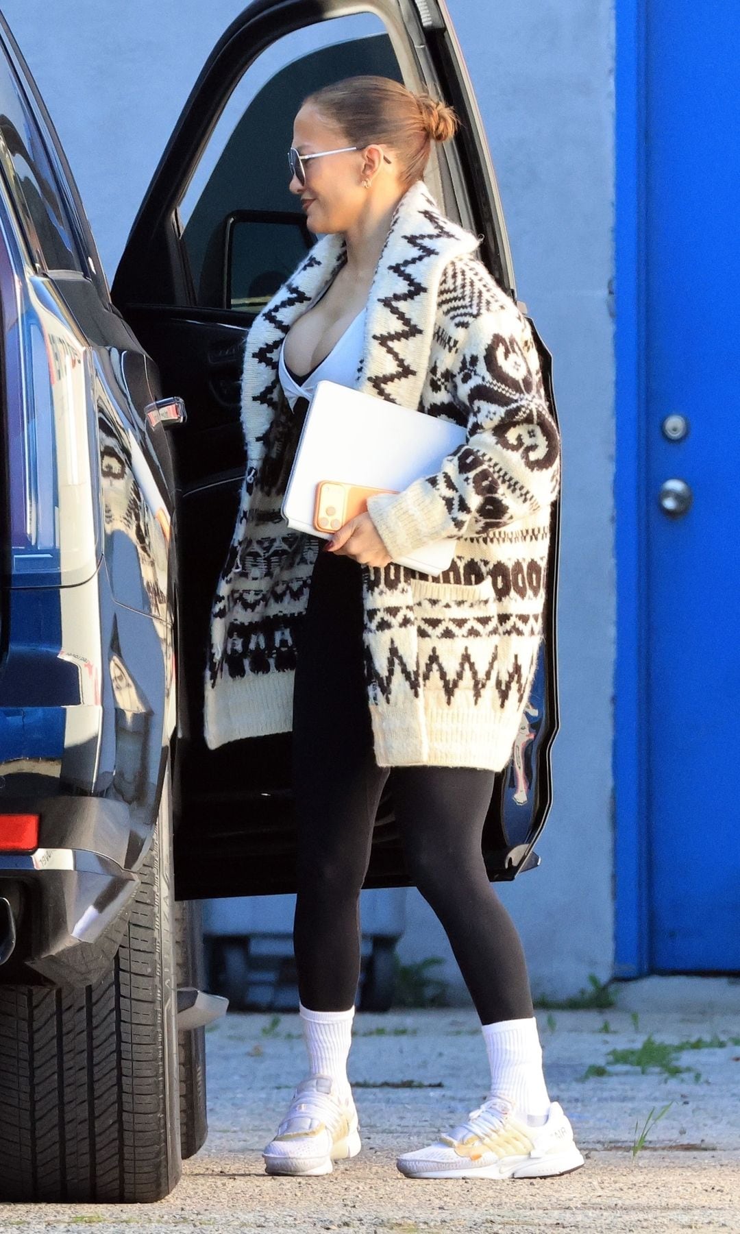 Lopez wore a festive cardigan for the occasion