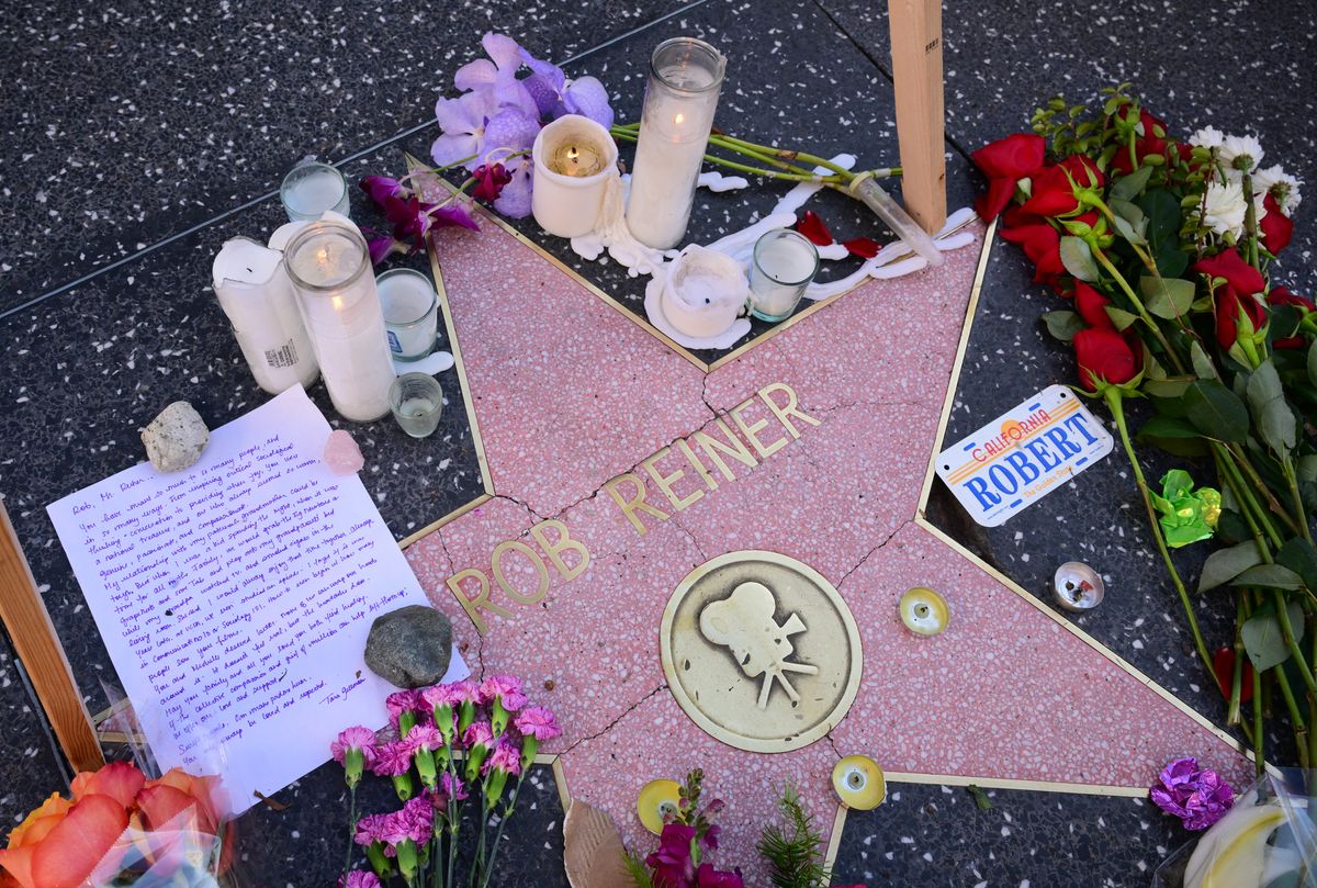 A growing makeshift memorial with flowers, candles and a letter are seen on the Hollywood Walk of Fames Star of the late US actor and director Rob Reiner.