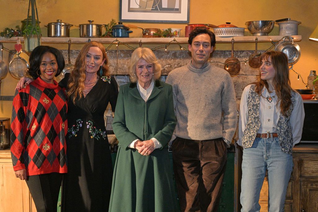 Queen Camilla, poses with actors Nafessa Williams, left, Victoria Smurfit, Alex Hassell and Bella Maclean 