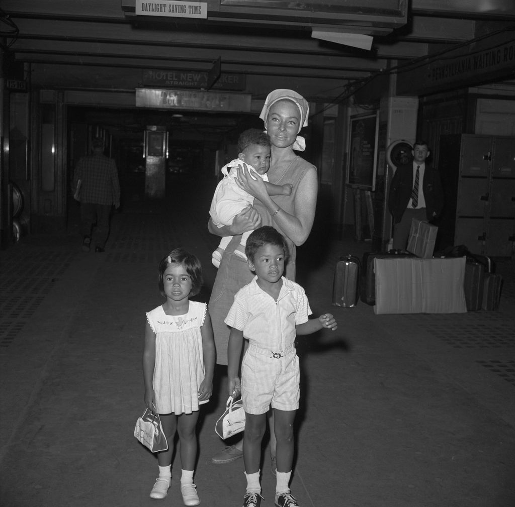 Mrs. Sammy Davis, Jr., also known as May Britt is with her children, Jeff, 6 months old; Tracey, 4 years old; and Mark, 5 years old. The two boys are adopted.