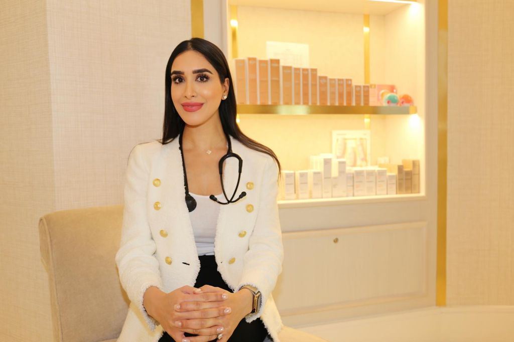 beautiful dark haired doctor wearing a stethoscope