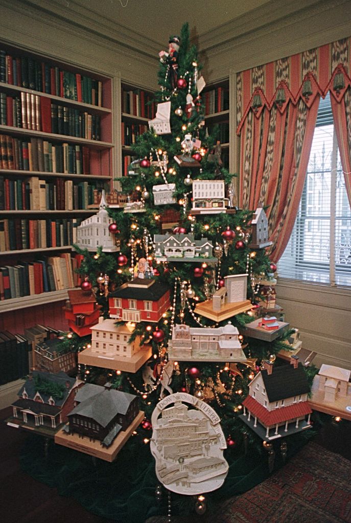A tree decorated with miniature versions of historic places stands in the library of the White House December 4, 2000 in Washington DC. First Lady Hillary Rodham Clinton announced that ''Holiday Reflections'' will be the White House holiday theme