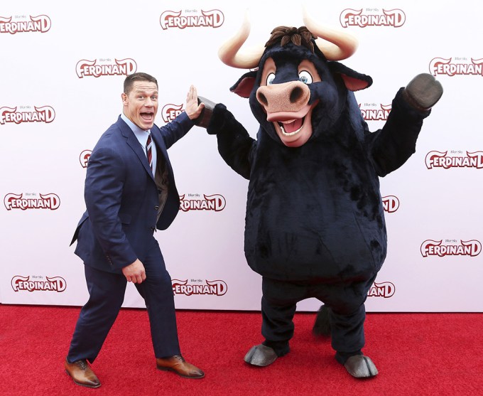 John Cena high fives a character from ‘Ferdinand’ at the premiere