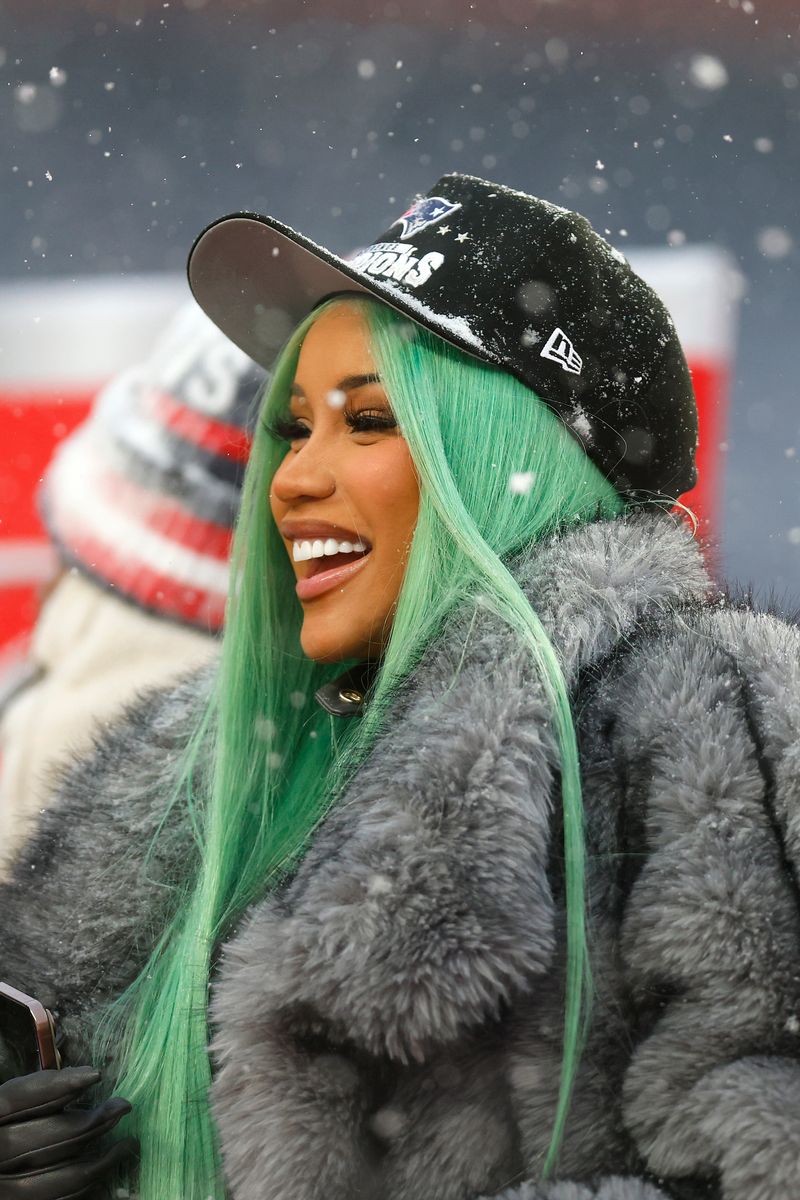 Cardi B celebrates following the AFC Championship Playoff game against the Denver Broncos.
