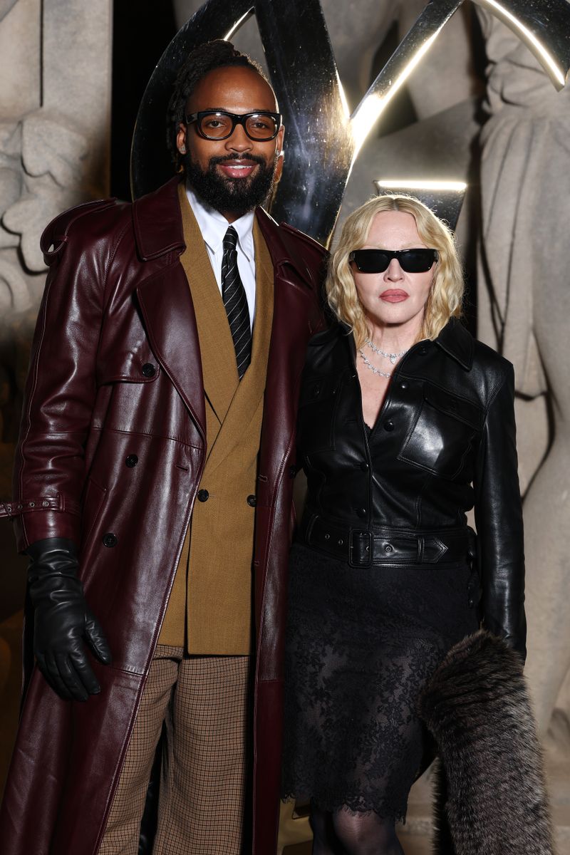 PARIS, FRANCE - SEPTEMBER 29: (EDITORIAL USE ONLY - For Non-Editorial use please seek approval from Fashion House)   Akeem Morris and Madonna attend the Saint Laurent Womenswear Spring/Summer 2026 show as part of Paris Fashion Week on September 29, 2025 in Paris, France. (Photo by Pascal Le Segretain/Getty Images) 