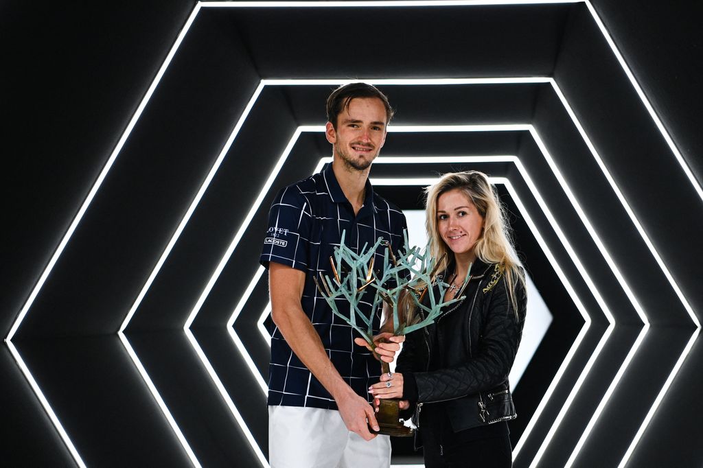 Russia's Daniil Medvedev (L) poses with the trophy and his wife Daria Medvedeva (R), after winning his men's singles final tennis match against Germany's Alexander Zverev, on day 7 at the ATP World Tour Masters 1000 - Paris Masters (Paris Bercy) - indoor tennis tournament at The AccorHotels Arena in Paris on November 8, 2020. (Photo by Anne-Christine POUJOULAT / AFP) (Photo by ANNE-CHRISTINE POUJOULAT/AFP via Getty Images)          