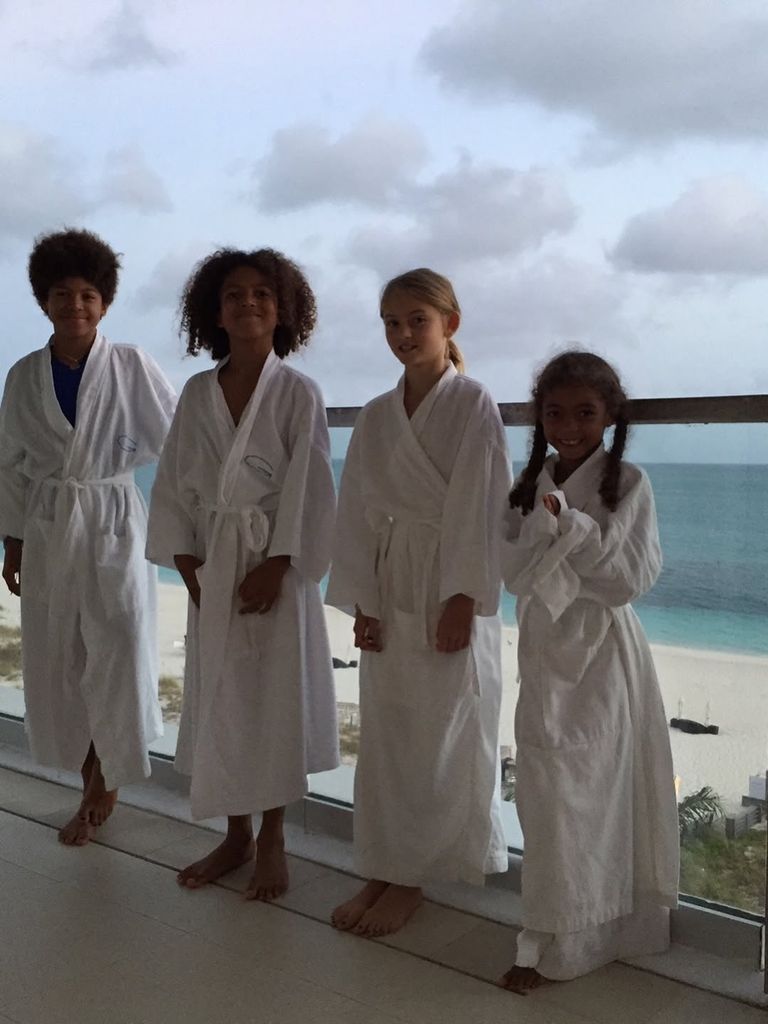 Heidi Klum's children posing in robes on balcony