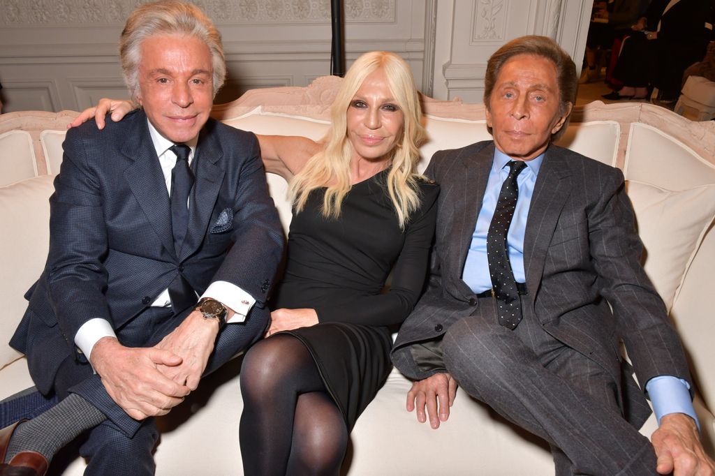 Giancarlo Giammetti, Donatella Versace and Valentino garavani lying on couch