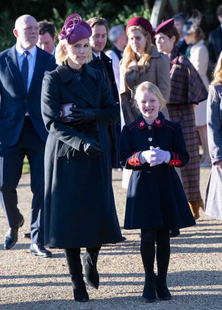 Lena Tindall and her mother Zara Tindall in coats outside church