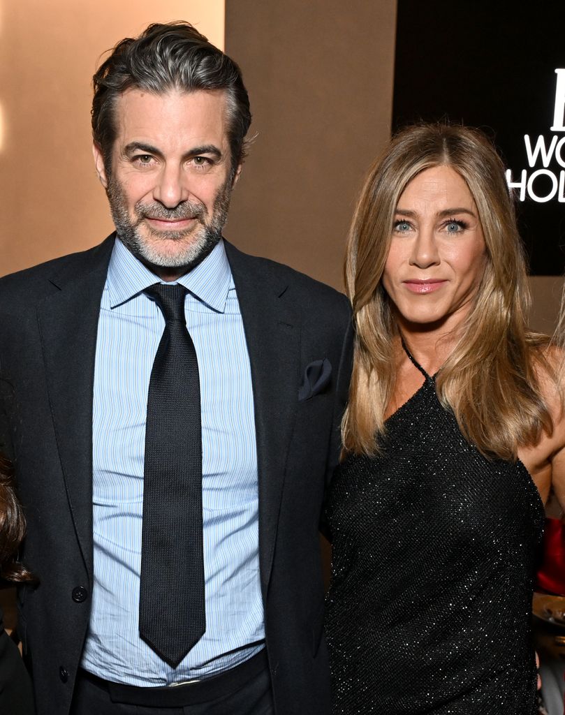 Jim Curtis and Jennifer Aniston, wearing Ralph Lauren, attend ELLE's 2025 Women in Hollywood Celebration presented by Ralph Lauren and Bvlgari with support from evian, Hendrick's Gin, and Lucid Motors on November 17, 2025 in Los Angeles, California