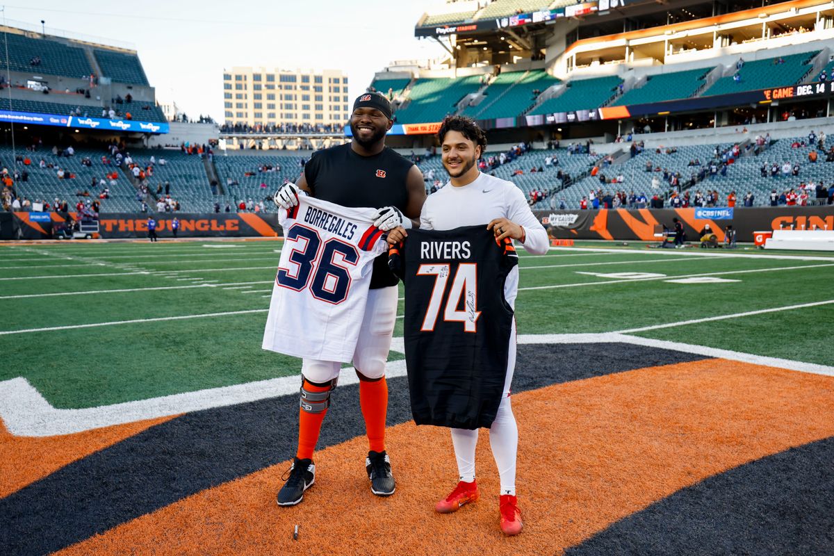 Jalen Rivers #74 of the Cincinnati Bengals and Kendall Milton #36 of the Cincinnati Bengals pose for a picture after the NFL 2025 game.