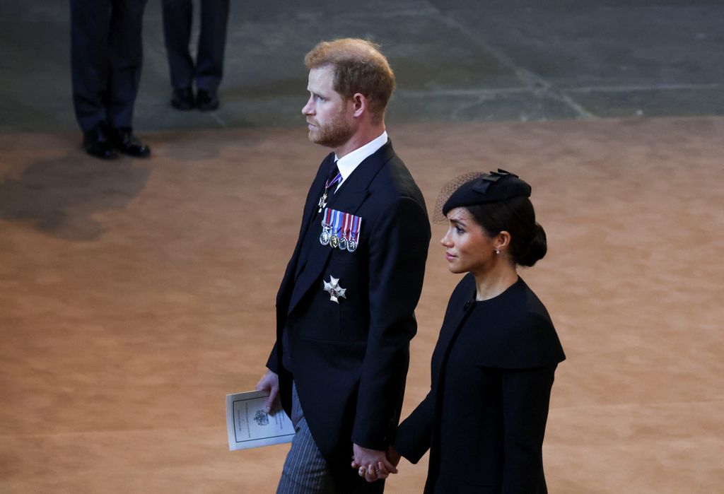 Prince Harry and Meghan Markle walking hand-in-hand