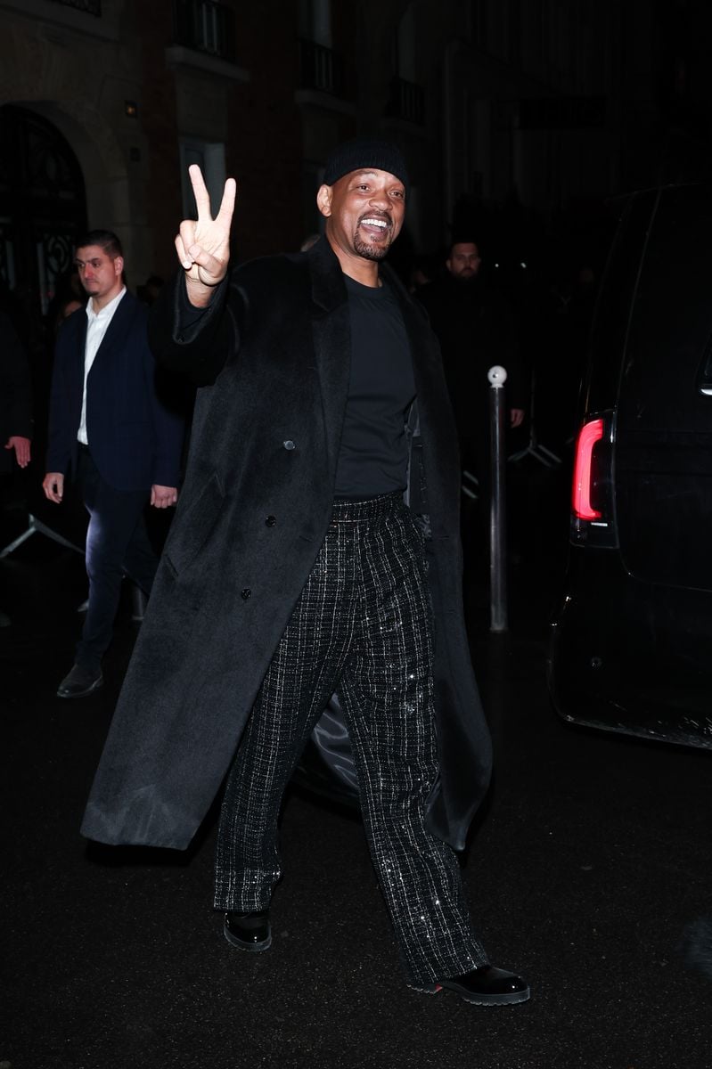 Will flashed a peace sign for the cameras