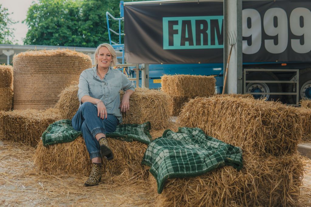 Steph McGovern sitting on stacks of hay
