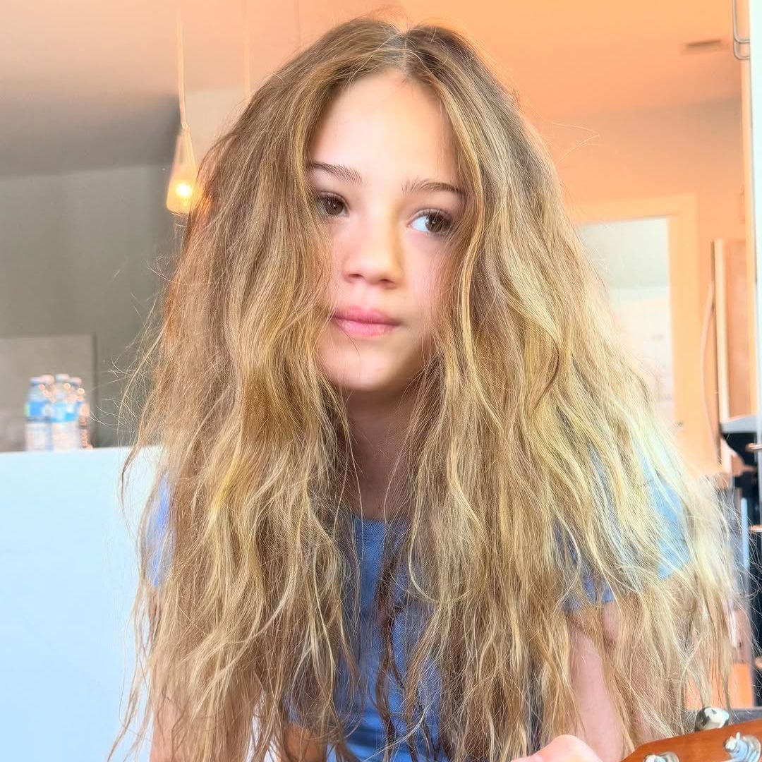 Skywalker Hughes plays a ukulele in a photo shared on Instagram