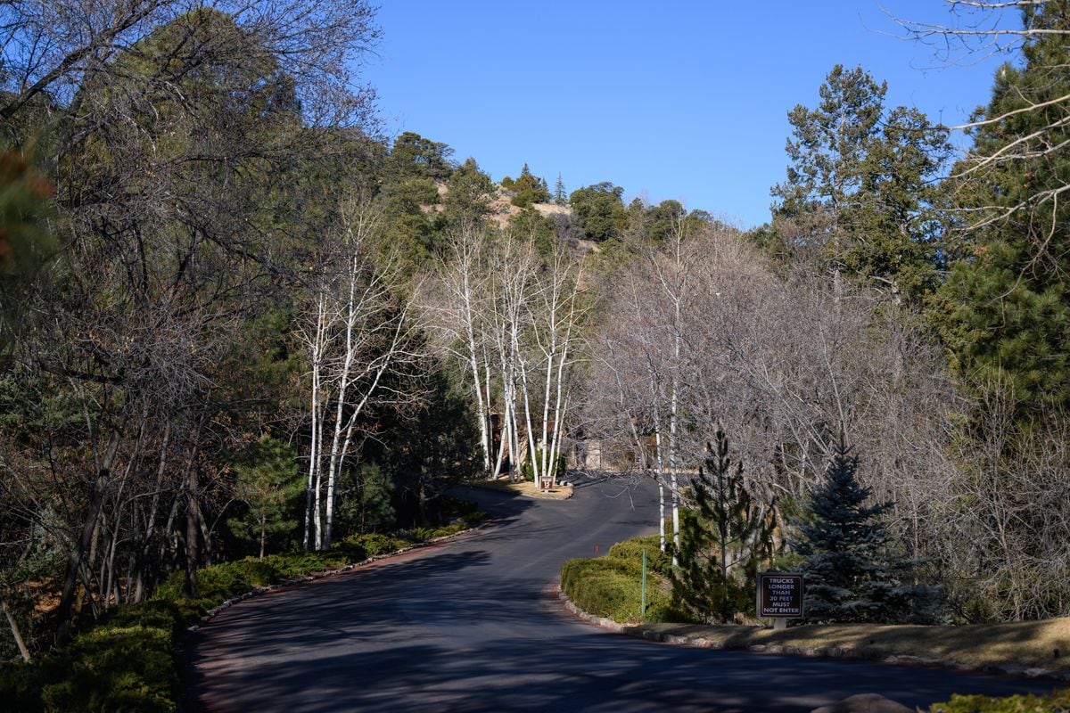 An exterior view shows a road entering the Santa Fe Summit community 