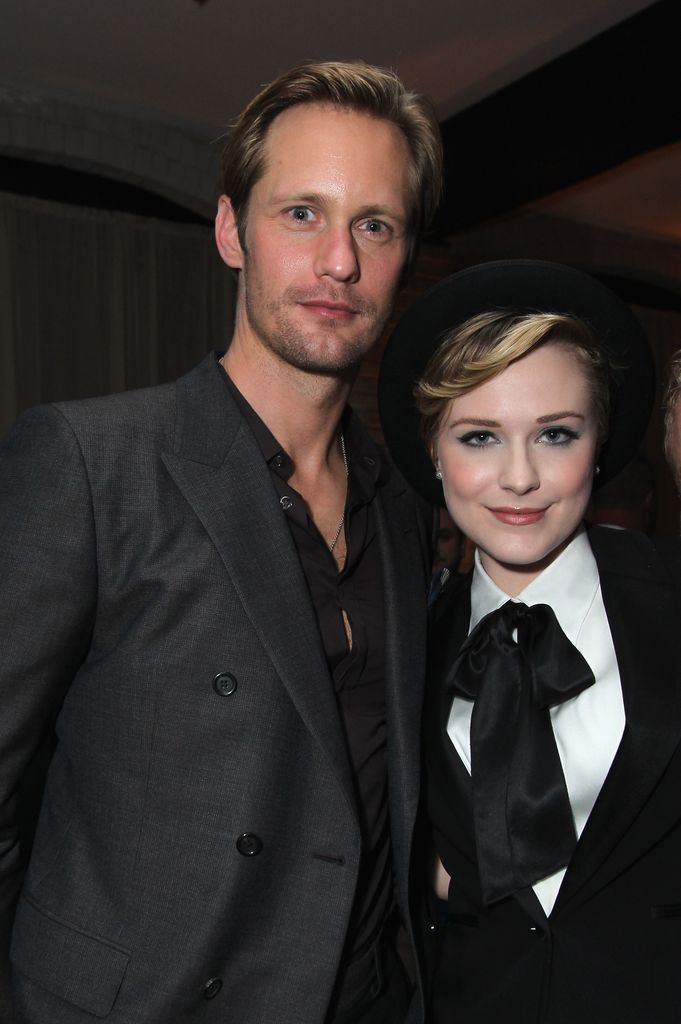 Alexander Skarsgard  in gray blazer and Evan Rachel Wood in suit at A Dangerous Method party 