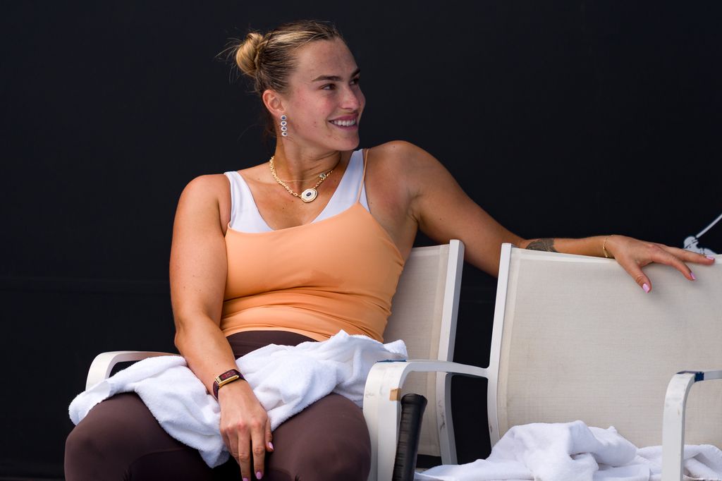 Aryna takes a break during a practice session 