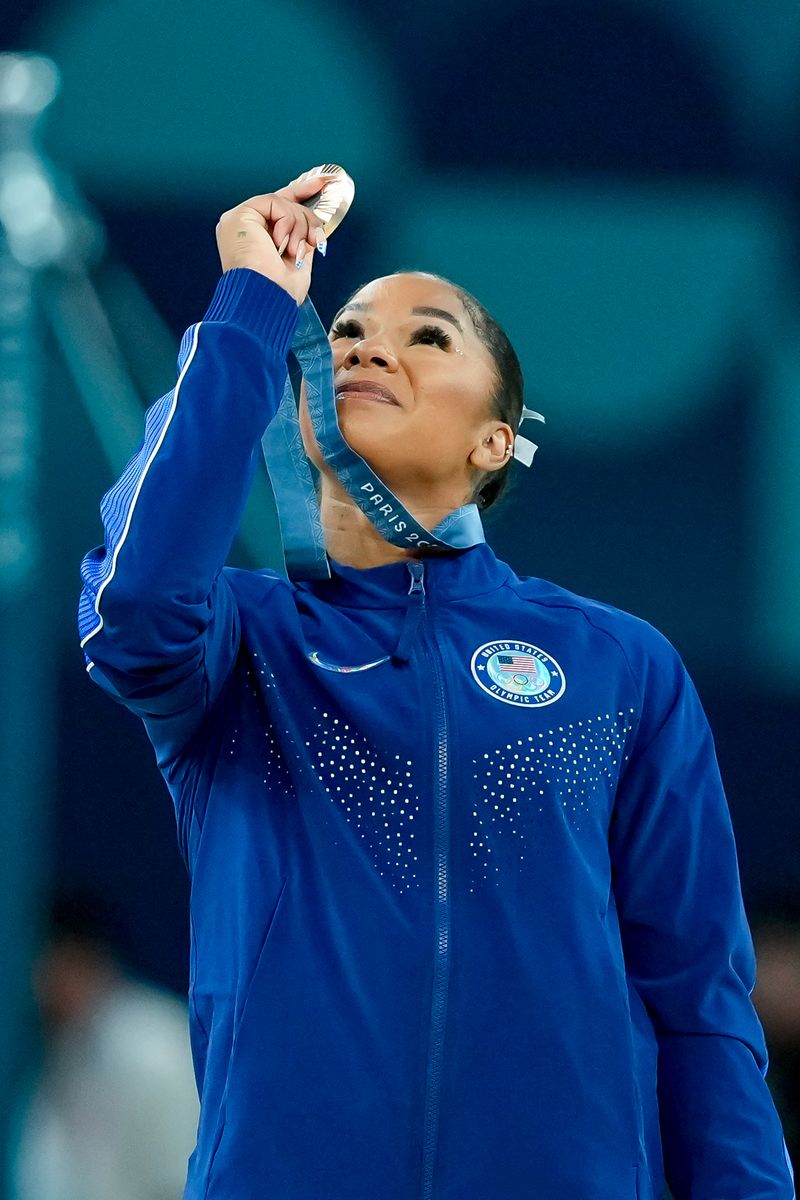 Jordan Chiles of the United States holds up her bronze medal during the ceremony after the Women's Floor Exercise Final.