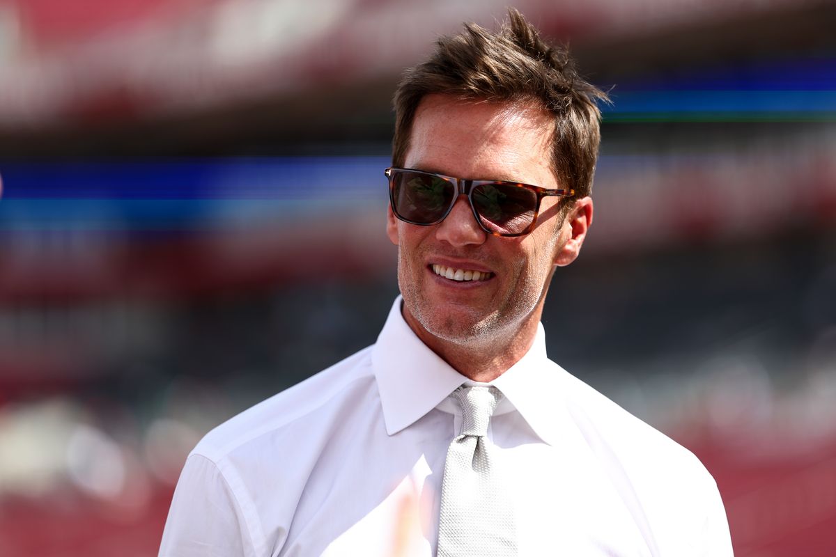  Fox Sports commentator and former NFL quarterback Tom Brady smiles prior to an NFL football game between the Tampa Bay Buccaneers and the Philadelphia Eagles at Raymond James Stadium on September 28, 2025 in Tampa, Florida. (Photo by Kevin Sabitus/Getty Images)