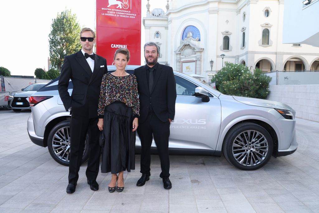  Alexander Skarsgard in tuxedo and Tuva Novotny in floral top in 2024