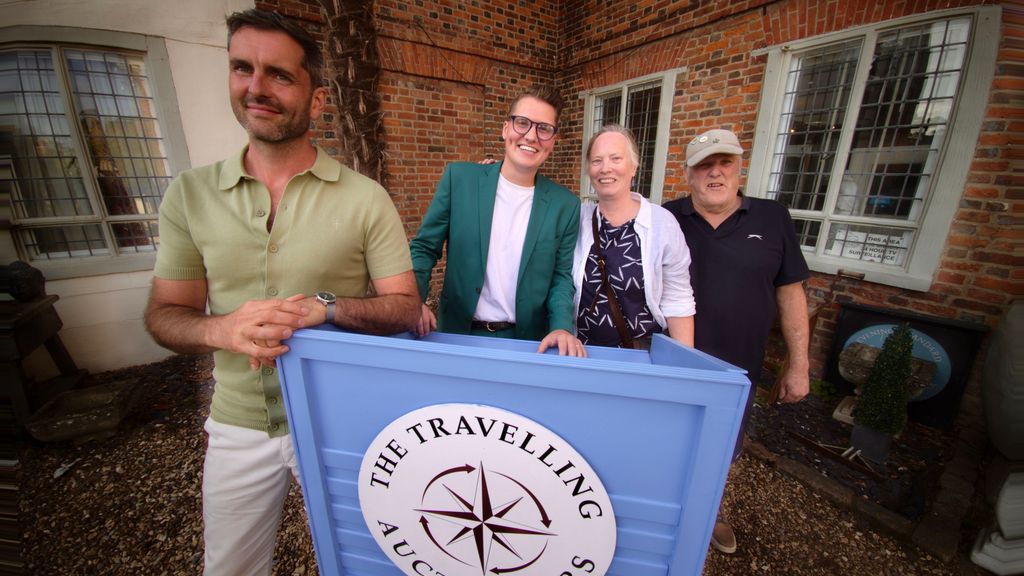 James Broad and Robin Johnson with an elderly couple outside a house