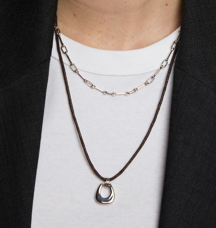 Silver, cord necklaces can be layered