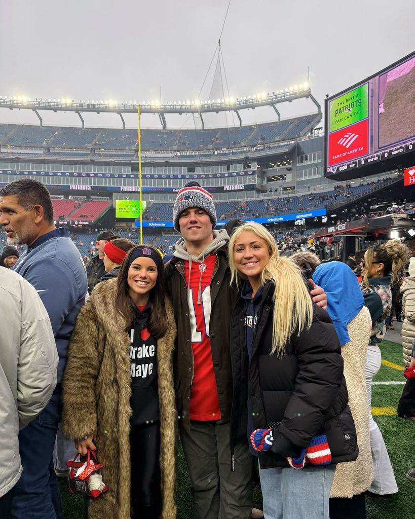 Ann and her brother at a Patriots game