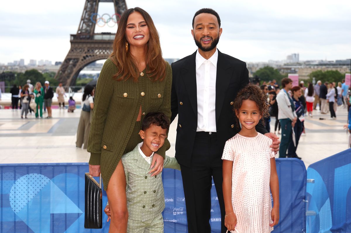Chrissy Teigen and John Legend attend with son Miles and daughter Luna the red carpet ahead of the opening ceremony of the Olympic Games Paris 2024 on July 26, 2024 in Paris