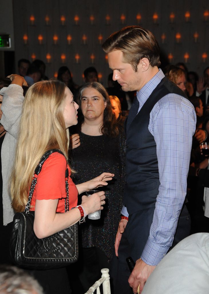 Amanda Seyfried in orange top and Alexander Skarsgard in waist coat at the HBO Premiere of True Blood Season 4 after party