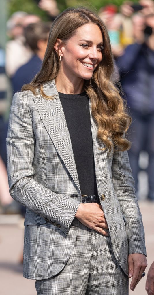 Catherine, Princess of Wales smiling in grey check suit