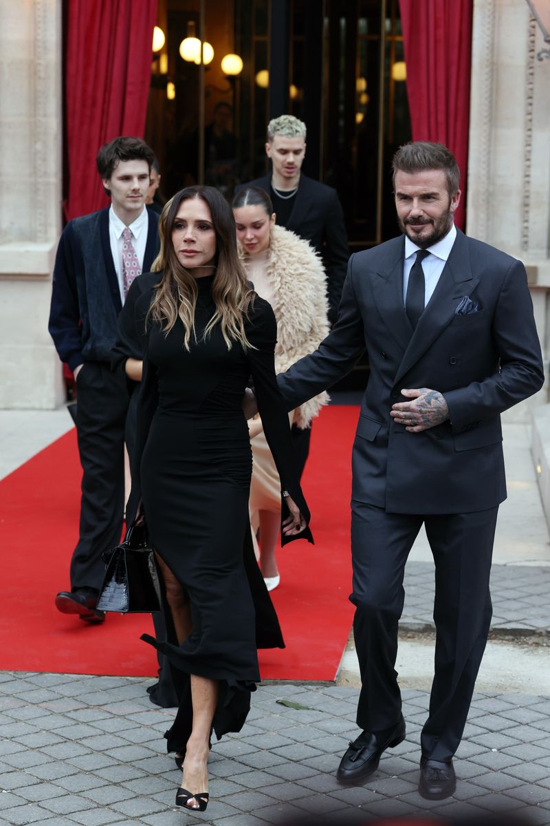Draped in a sleek, figure-hugging black gown with thigh-high slits, the designer stepped into the French capital not just as a fashion fixture, but as an honoree. 