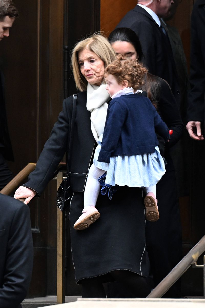 When Caroline Kennedy stepped out of the Church of St. Ignatius Loyola cradling her baby granddaughter in her arms, the image felt heartbreakingly familiar. 