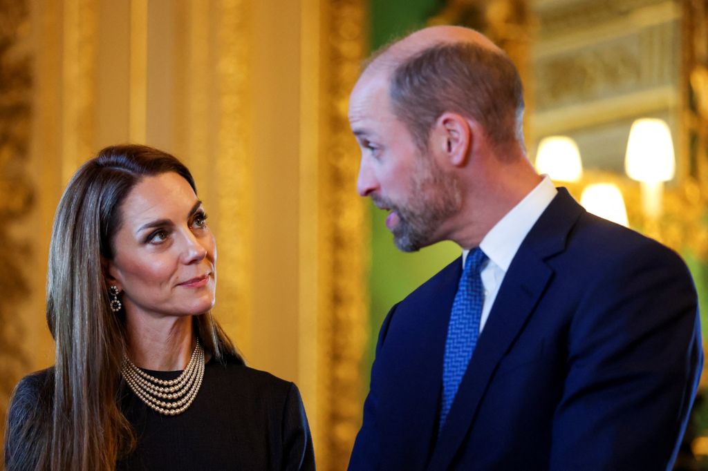 Catherine, Princess of Wales and Prince William looking seriously at each other