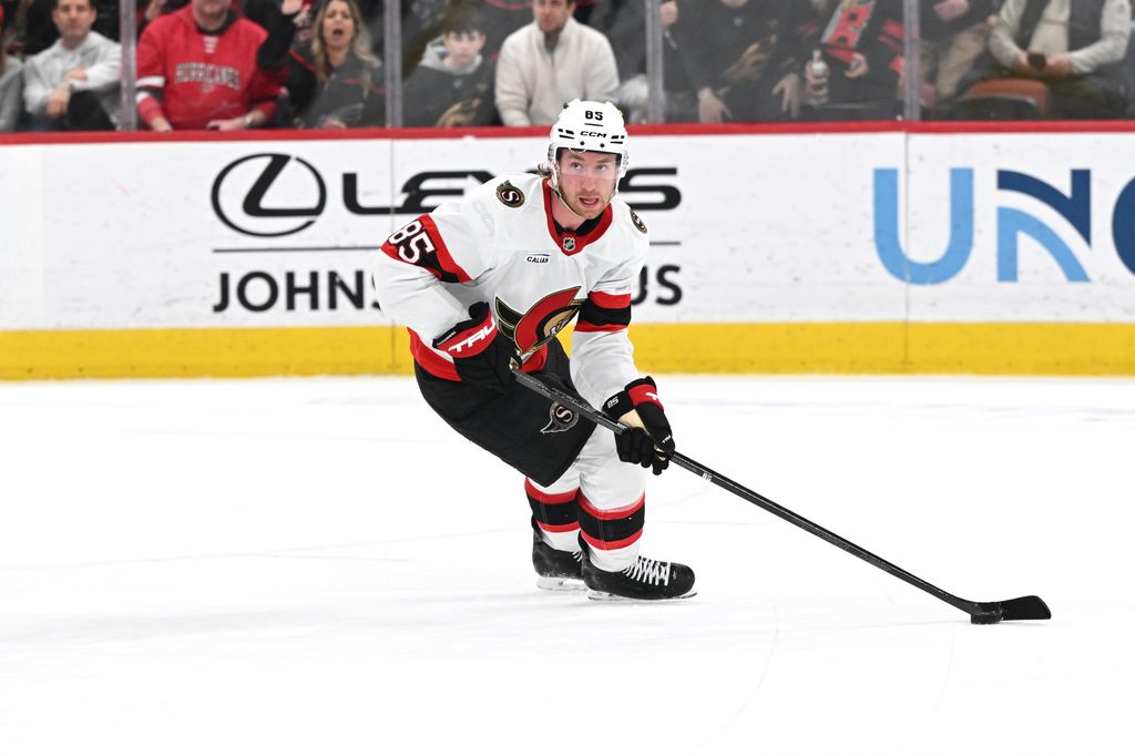 Defenseman Jake Sanderson (85) of the Ottawa Senators looks to pass the puck during the NHL game between the Ottawa Senators and the Carolina Hurricanes on February 3, 2026 at Lenovo Center in Raleigh, North Carolina. (Photo by Katherine Gawlik/Icon Sportswire via Getty Images)