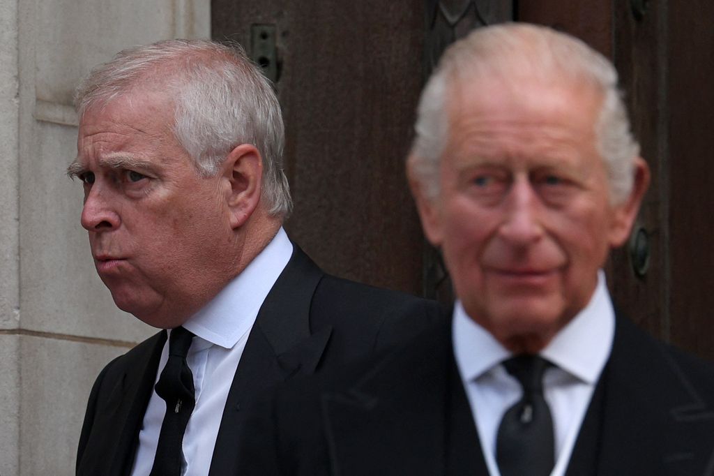 Britain's Prince Andrew, Duke of York (L) and Britain's King Charles III leave following a Requiem Mass, a Catholic funeral service
