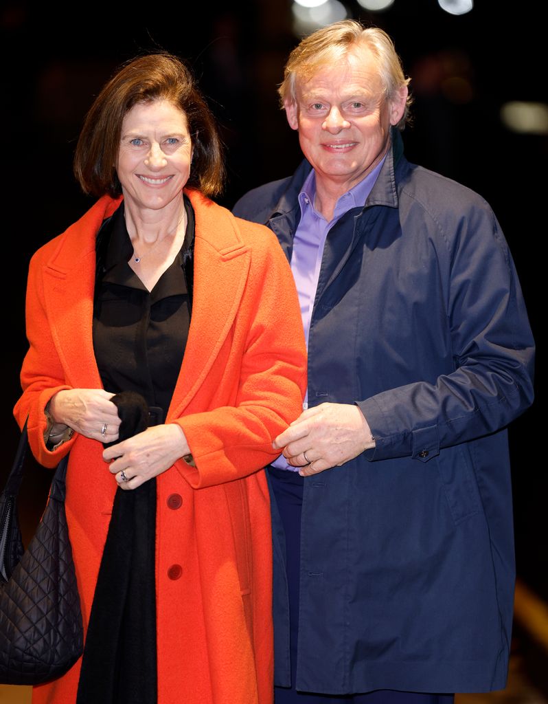 Martin Clunes stands to his wife Philippa's left.