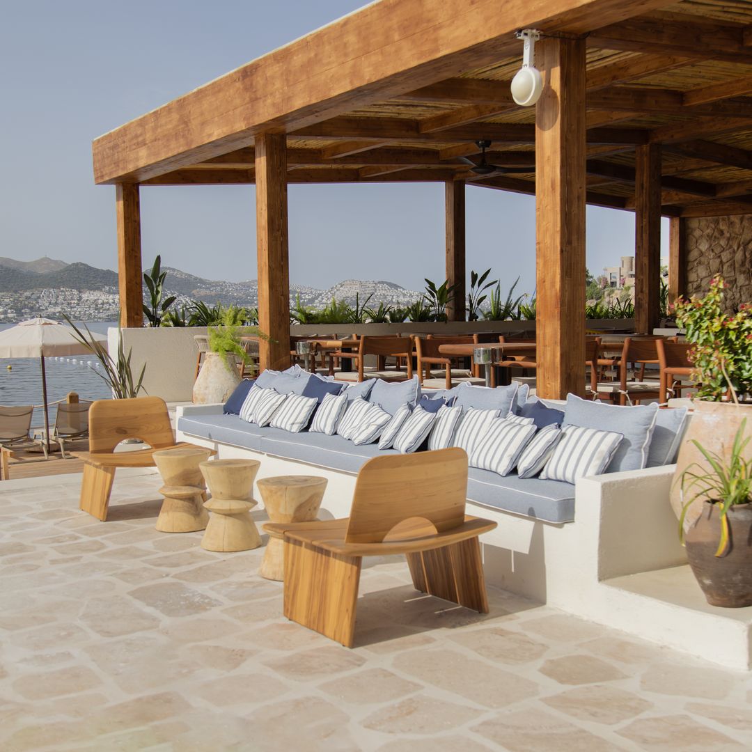 Outdoor lounge and restaurant terrace at Avantgarde Refined Bodrum overlooking the sea in Yalıkavak.