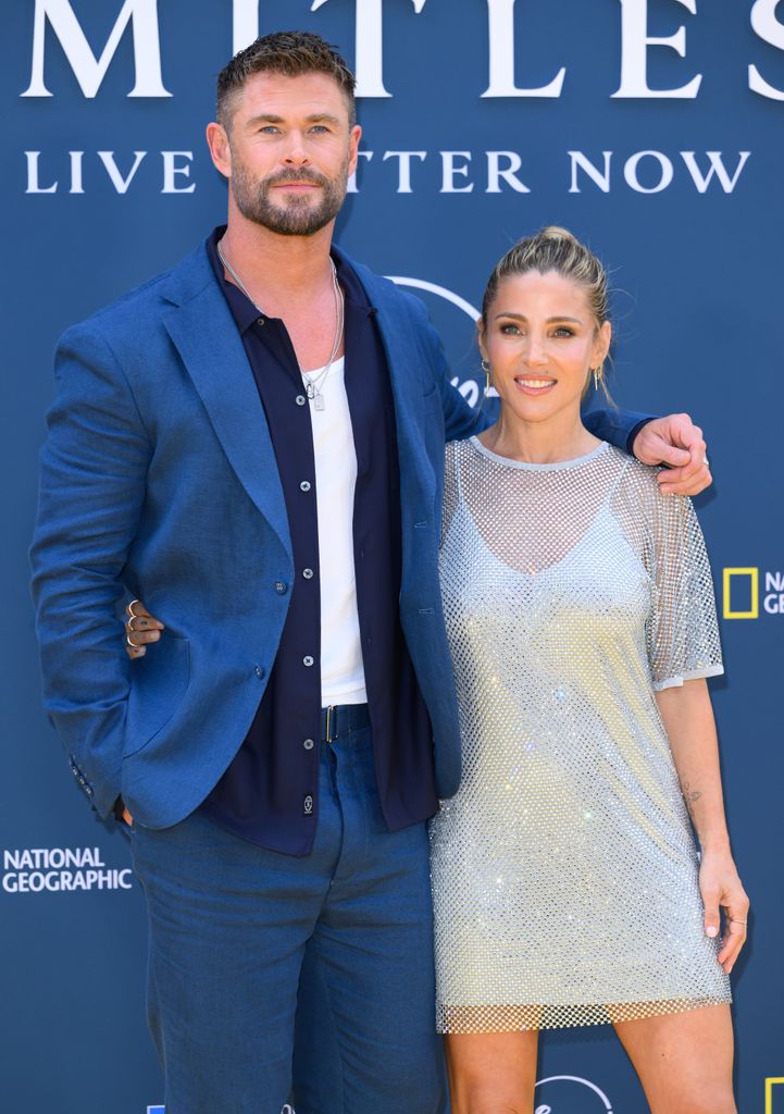 chris hemsworth in blue suit elsa pataky and silver dress