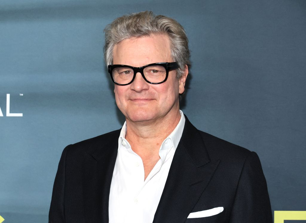 close-up actor wearing glasses and suit