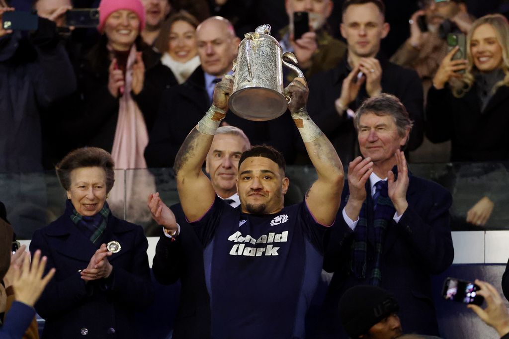 A photo of Princess Anne and Sione Tuipulotu 